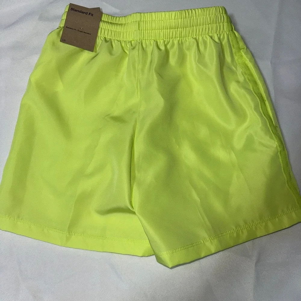 Nike Kids' Dri-FIT Multi Woven Shorts in Light Lemon Twist/White, size‎ XS
